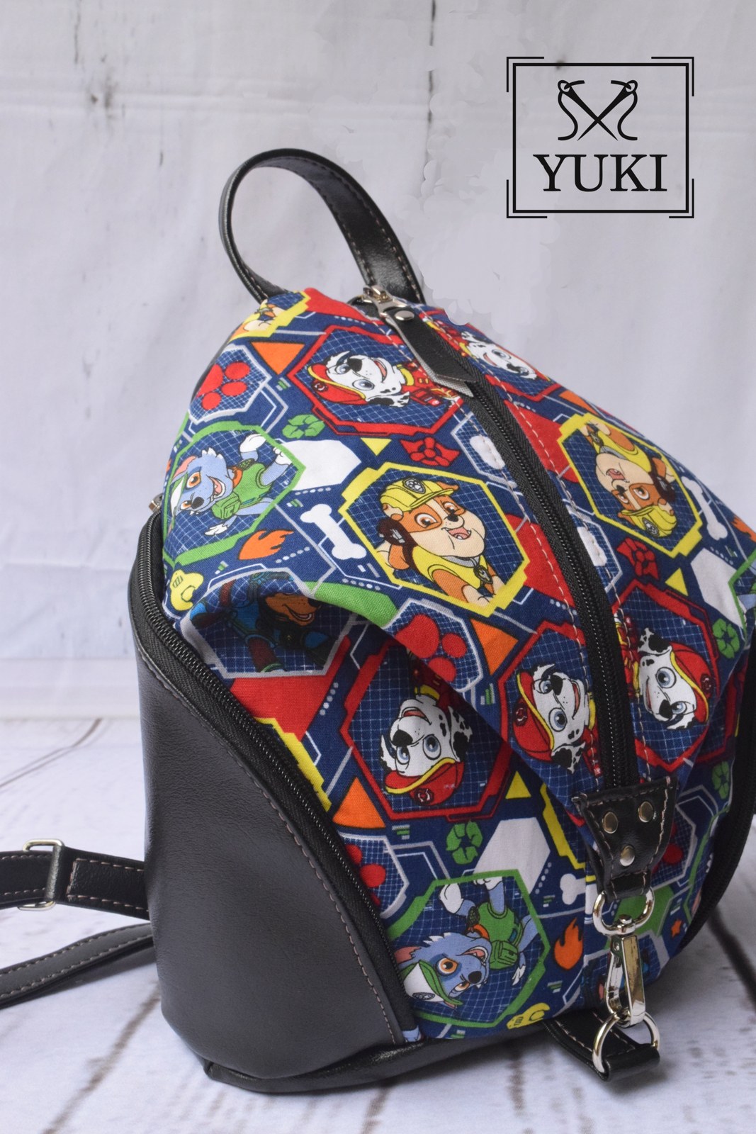 Mini Denver backpack with colourful Paw Patrol fabric and black trim